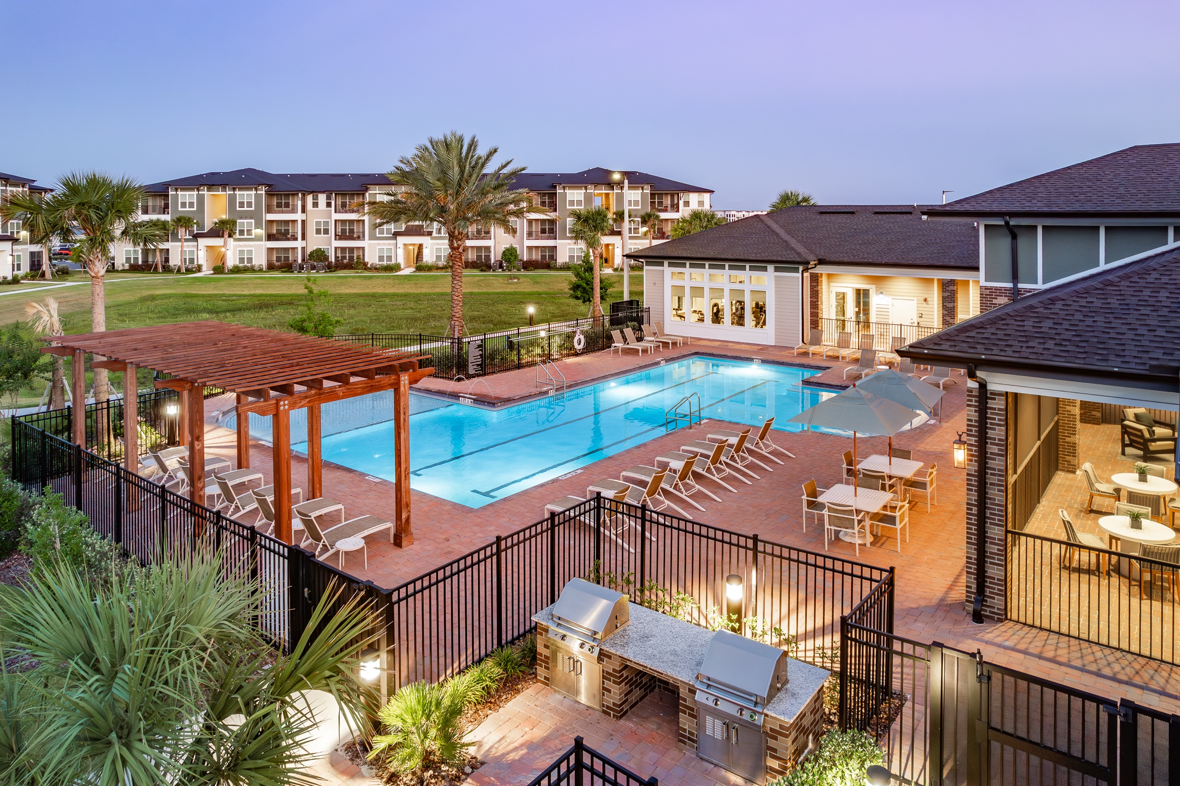 Cagan multifamily pool and clubhouse twilight hero
