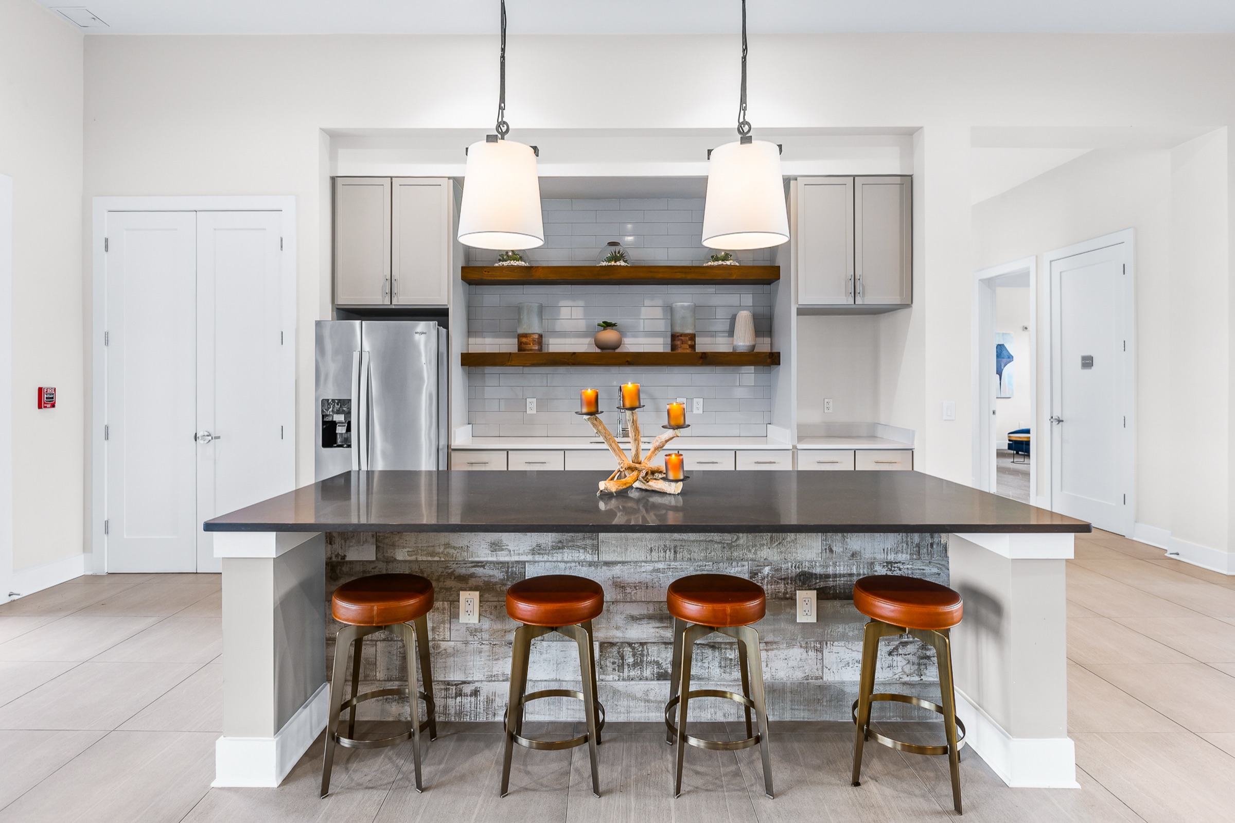 Academy Park clubhouse kitchen island and stools