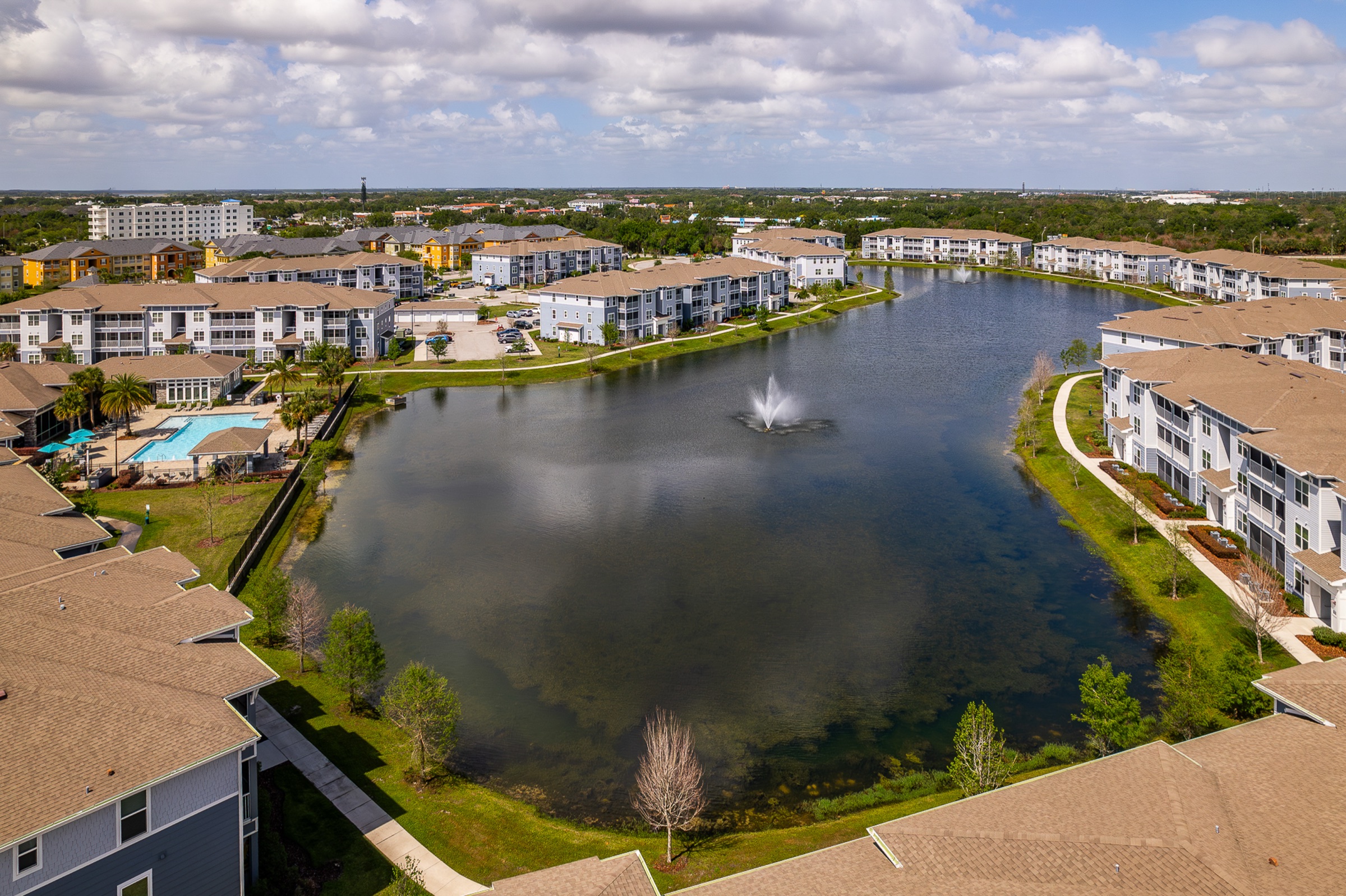 Academy Park lake and apartment community aerial
