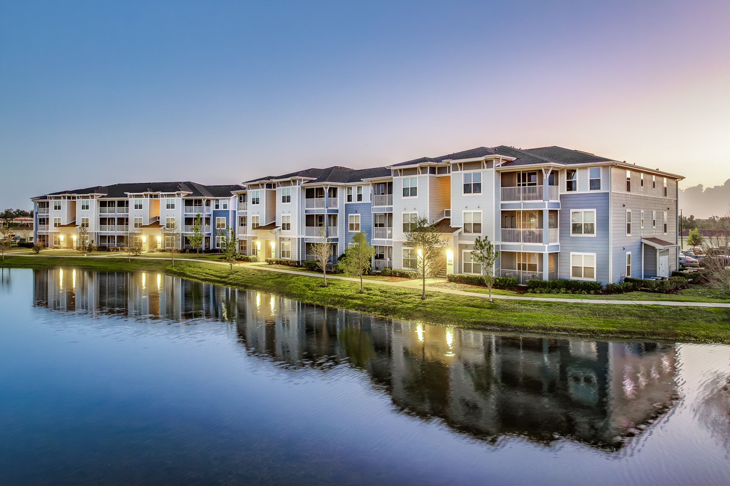 Multifamily community lakefront twilight exterior