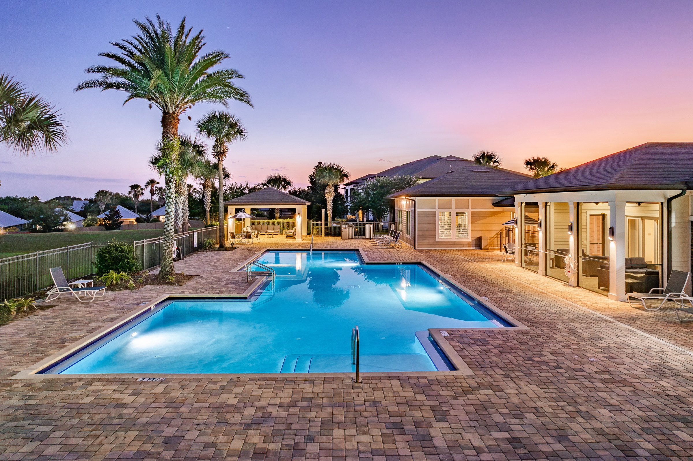 Multifamily resort-style pool at blue hour