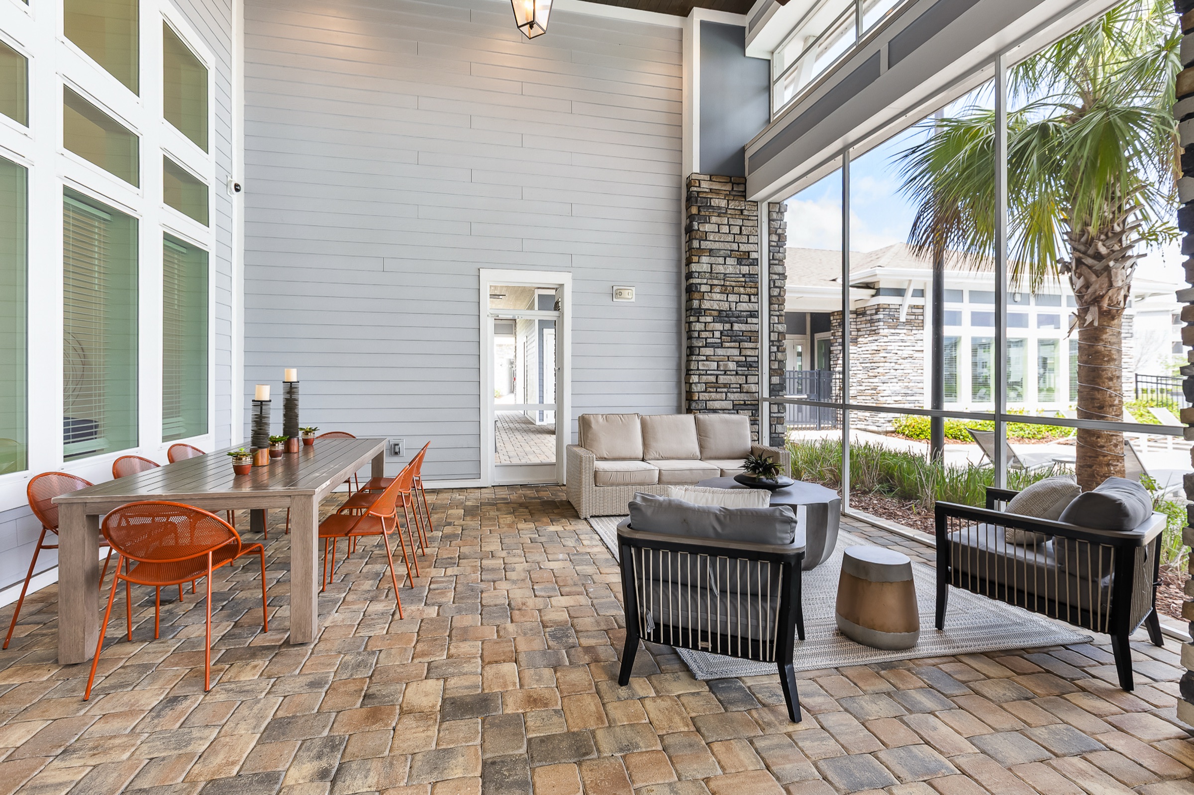 Multifamily indoor outdoor amenity lounge and patio