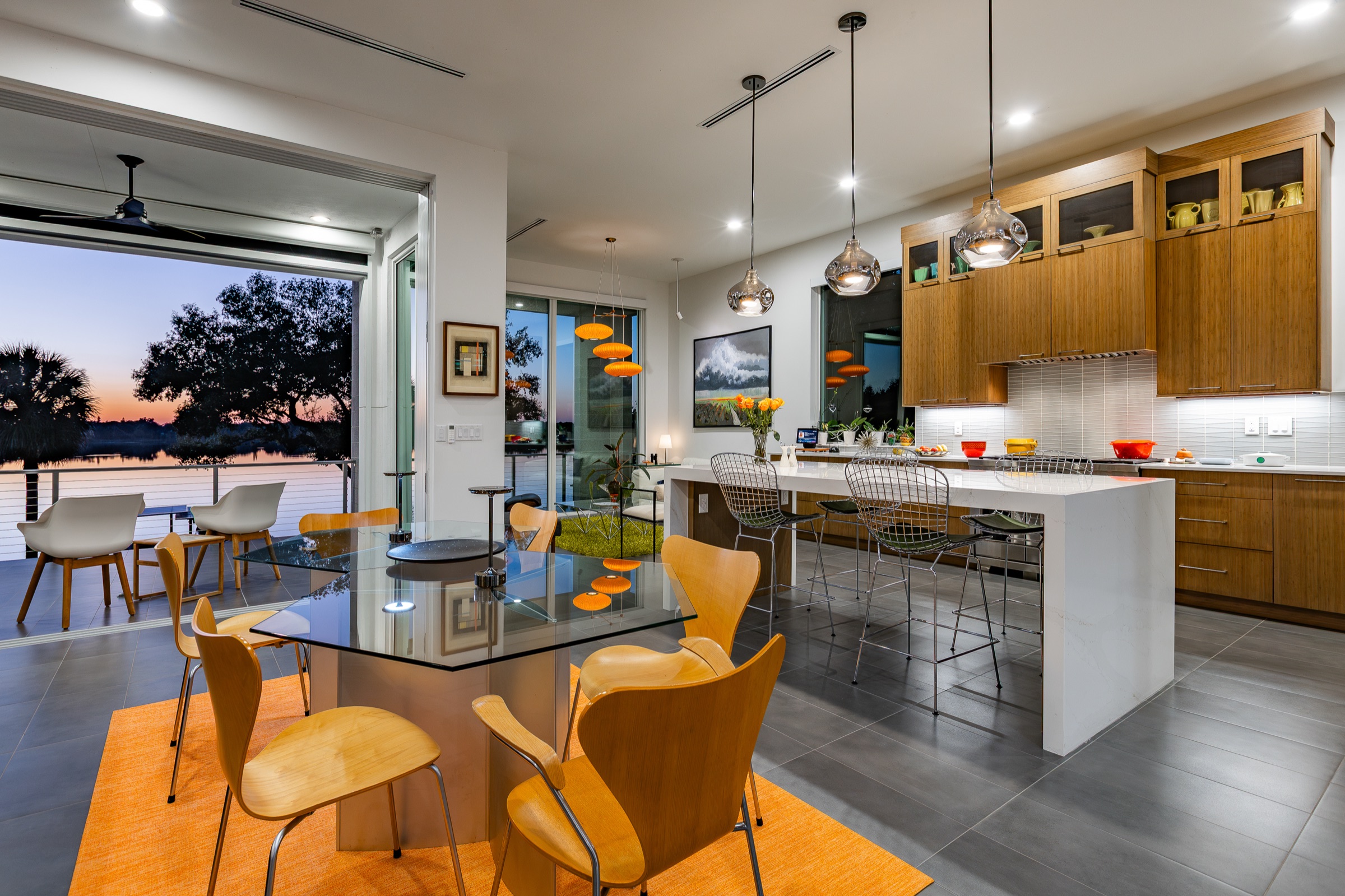 Residential warm kitchen and living interior at evening