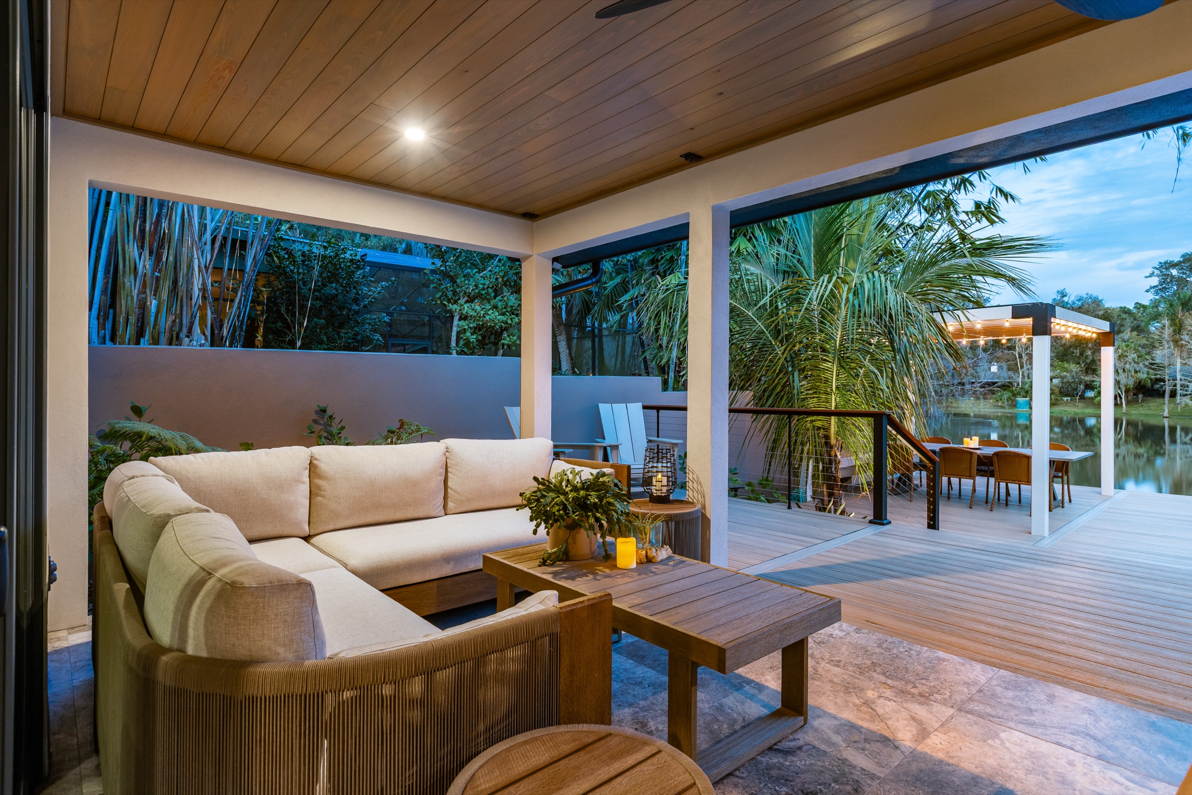 Residential covered outdoor lounge and wood ceiling