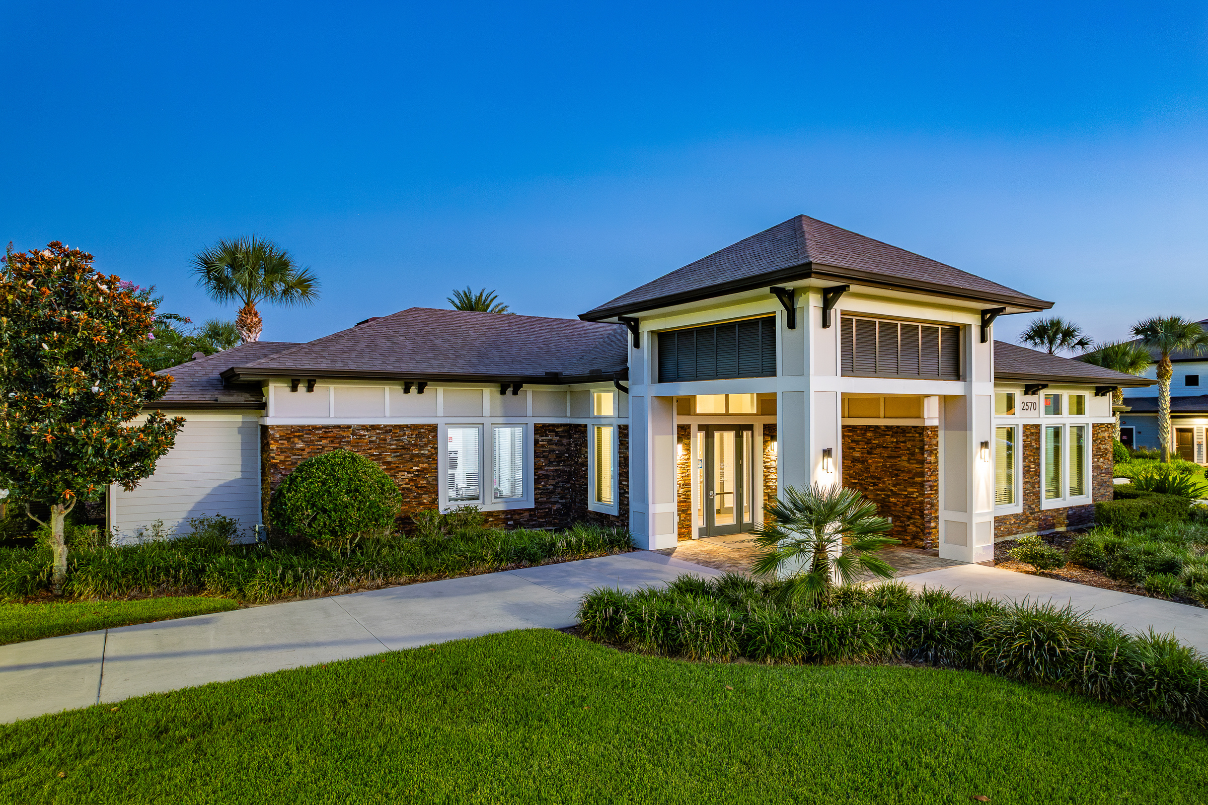Multifamily resort-style pool at blue hour